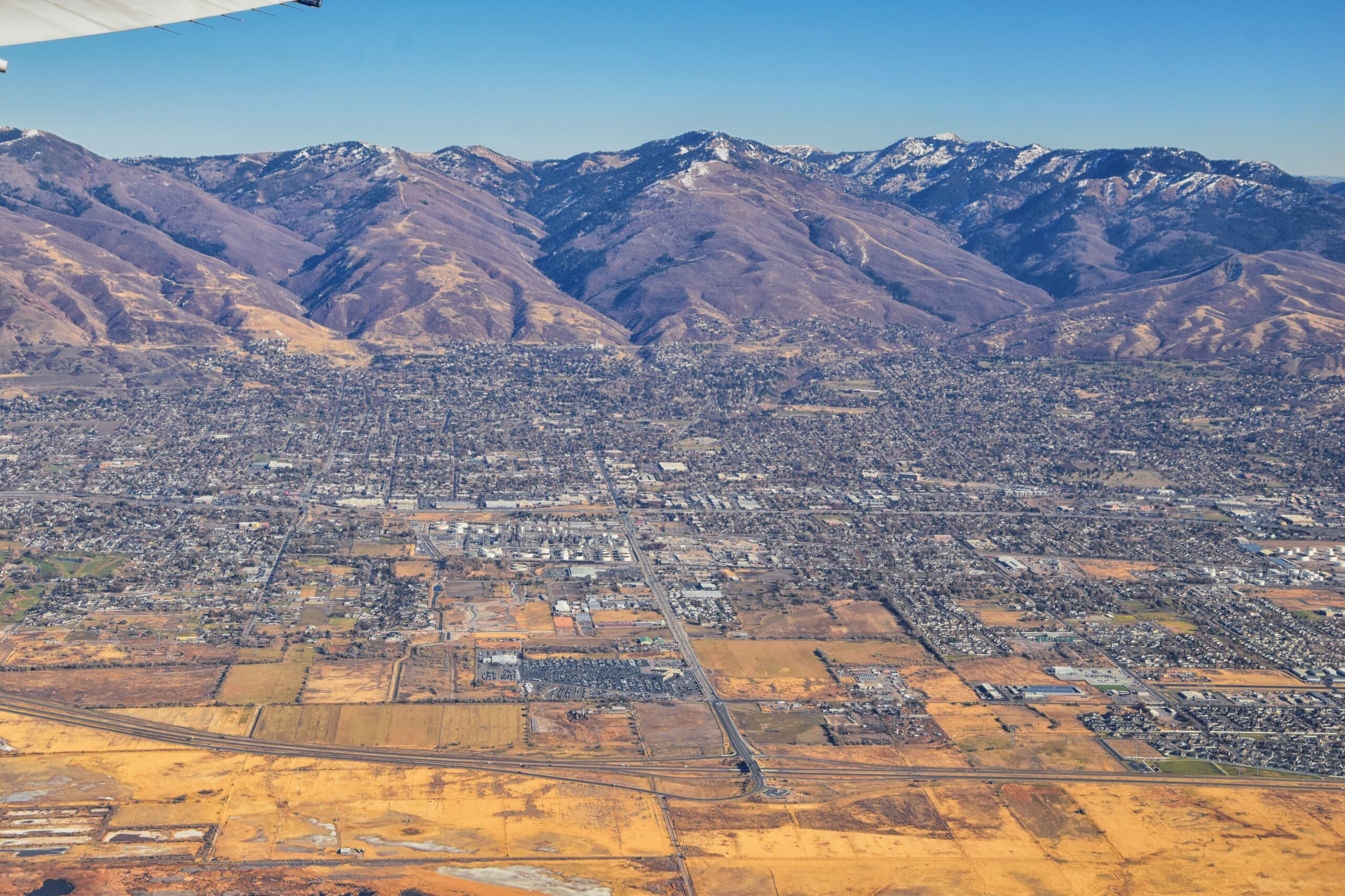 American Fork Roofing Services – Top Rated Roofs American Fork, Utah neighborhood with rooftops and mountain backdrop